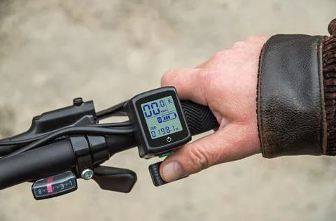 Hand on the trigger electronic accelerator of electric bike Stock Photos