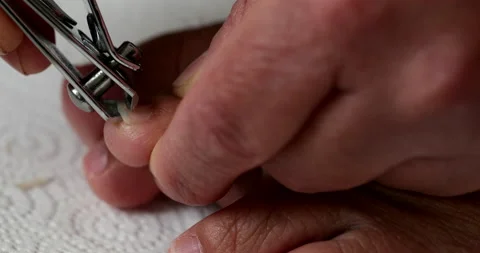 Hand Trimming Toenails Stock Footage 140628816