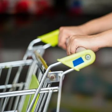 Hand with trolley Stock Photos