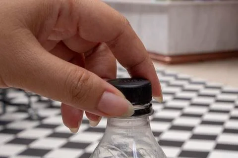 Hand try to open the bottom Stock Photos