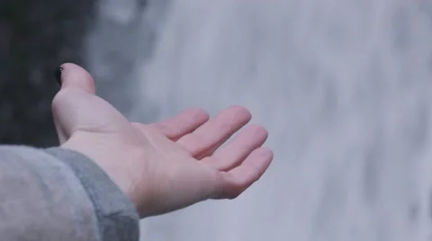 Hand Trying to Catch Water from Waterfall Video stock 58932687