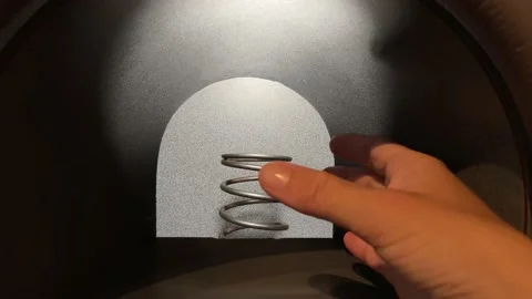 Hand trying to touch spiral which is made by virtual reality and is an illusion Stock Footage 154606649