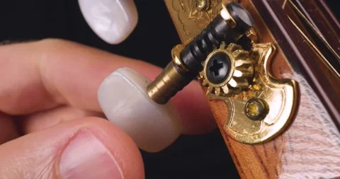 Hand Tuning Classical Flamenco Guitar Strings Close Up Stock Footage 159997341