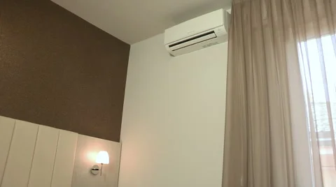 A hand turn on the air conditioner in the wall Stock Footage 61672340