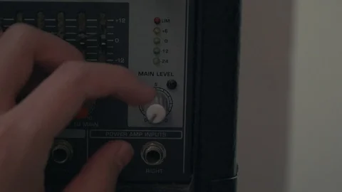 Hand turn on level knob of analog mixer Stock Footage 87910661