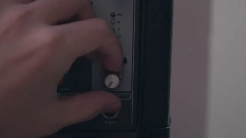 Hand turn on main level knob and fx level knob on analog mixer Stock Footage 87910715