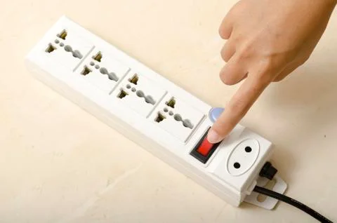 Hand turn on switch multiple  socket plug Stock Photos