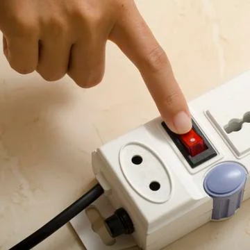 Hand turn on switch multiple  socket plug Stock Photos