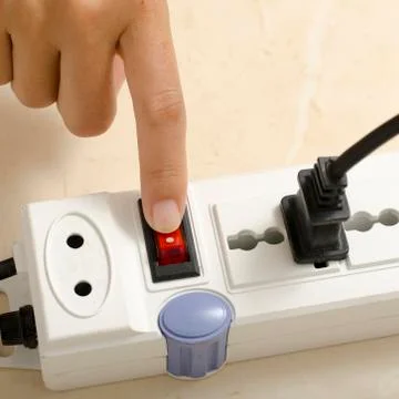 Hand turn on switch multiple  socket plug Stock Photos