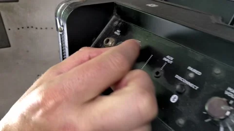 Hand turning amp volume closeup Stock Footage 133800686