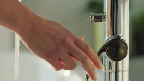 Hand turning on Bath Tap Stock Footage 260356885