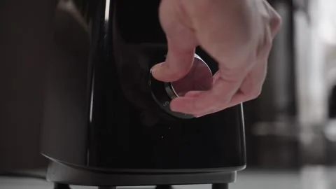 Hand Turning Blender Control Knob to Stop Kitchen Appliance Stockbeeldmateriaal 331786940
