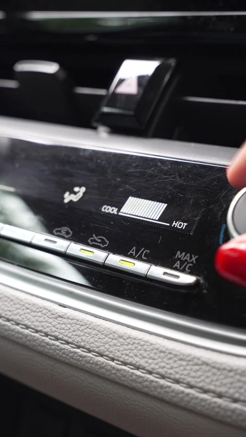 Hand turning the car climate control to maximum heat Stock Footage 345011219