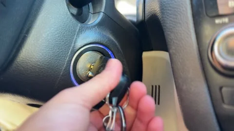 Hand Turning Car Ignition Key to Start Engine — Automotive Interior Close-Up Stock Footage 320552029