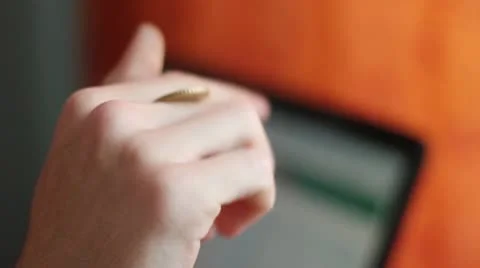 A hand turning coin 스톡 동영상 18348241