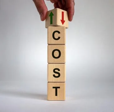 Hand is turning a cube and changes the direction of an arrow symbolizing that Stock Photos