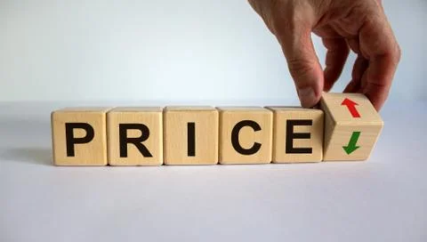 Hand is turning a cube and changes the direction of an arrow symbolizing that Stock Photos