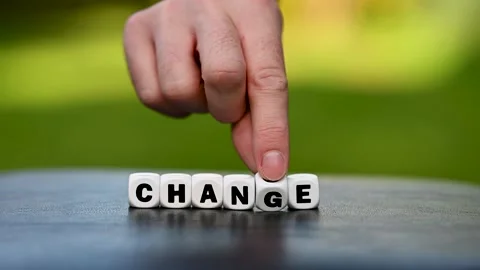 Hand is turning a dice and changes the word change to chance. Stock Footage 227328560
