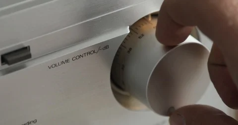 Hand is turning down the volume in a stereo. Stock Footage 108013909