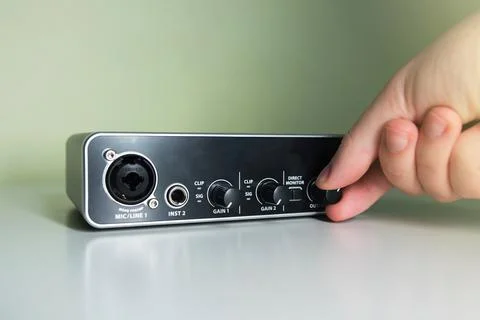 Hand turning a knob Stock Photos