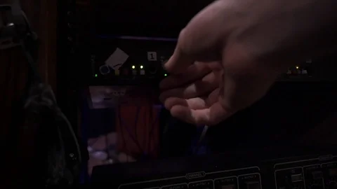 Hand turning knobs at control room Stock Footage 126522780