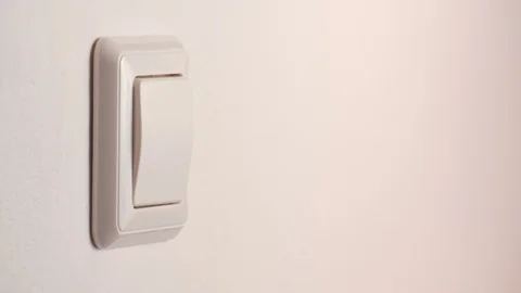 Hand turning on a light switch Stock Footage 88387053