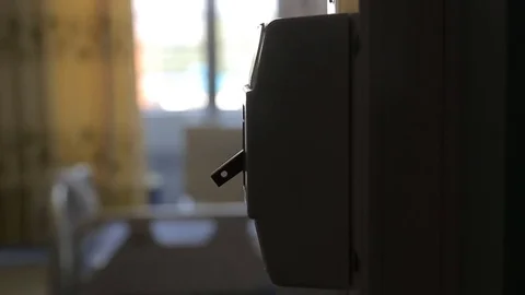 A hand turning on a light switch in a house Stock Footage 78502546