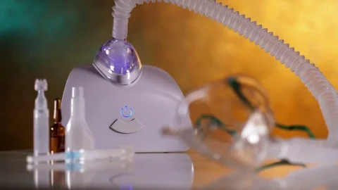 Hand turning on nebulizer inhaler device Stock Footage 81053698