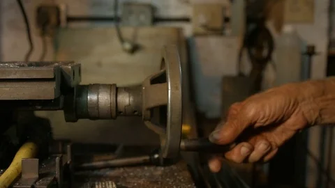 Hand turning old machine wheel. Stock Footage 72182220