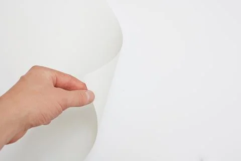 Hand turning page Stock Photos