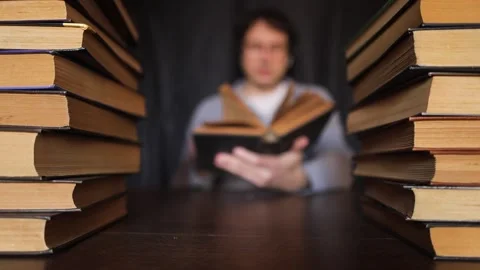 Hand Turning Pages of a Book. Unrecognizable Person's Hand reading a book and ho 스톡 동영상 271644470