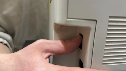 Hand turning printer power on or off with side switch button, office equipment 動画素材 337121656