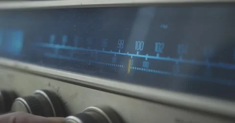 Hand Turning Radio Frequency Dial Knob on Retro Home Stereo System Stock-Footage 344348977