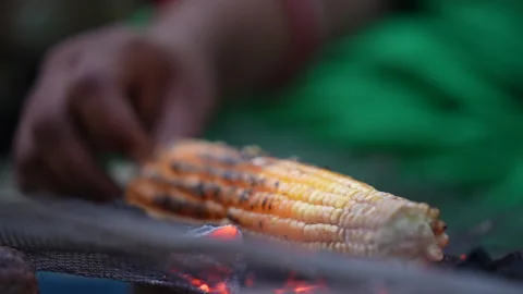 Hand Turning Roasted Corn Cob Over Charcoal Embers In India Stock Footage 341165972