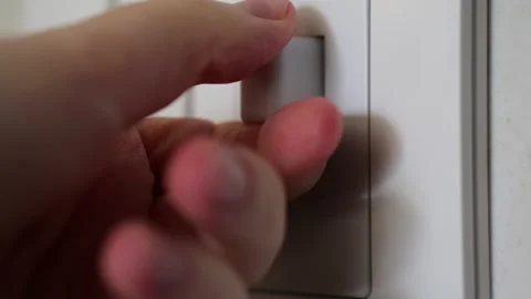 Hand turning shredder switch on in slow motion Stock Footage 306193375