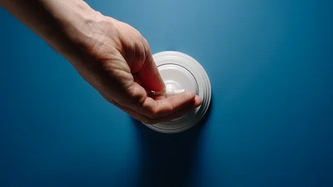 Hand Turning On A Toggle Switch On The Blue Wall 動画素材 110774530