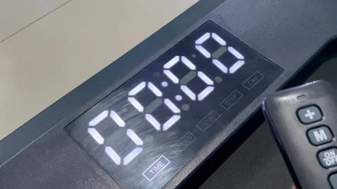 Hand Turning On Treadmill Using Remote Control Stock Footage 325567734