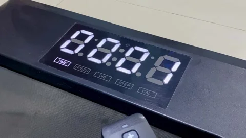 Hand Turning On Treadmill Using Remote Control Stock Footage 325567754