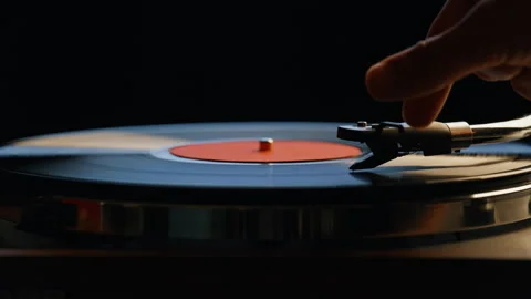 Hand turning off vinyl turntable in night room closeup. Unrecognizable man Stock Footage 332616893