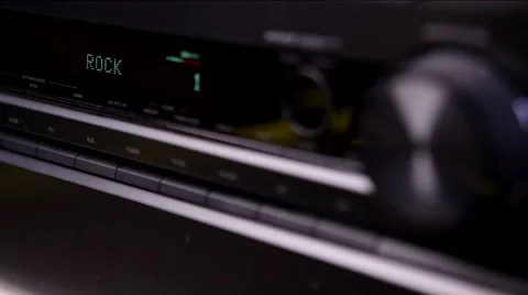 Hand turning up volume on stereo Stock Footage 54310138