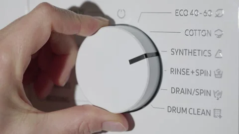 Hand turning washing machine program selector knob 스톡 동영상 344341471