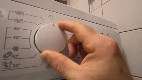 Hand Turning Washing Machine Program Selector Dial Stockbeeldmateriaal 348243537