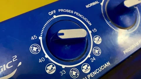 Hand Turning Washing Machine Timer Dial Stock Footage 325363655