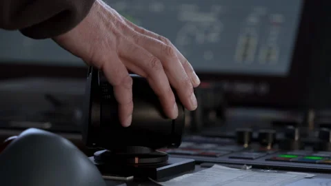 Hand turns azimuth controller. Vessel navigation bridge. Azipod control turns Stock Footage 236655767