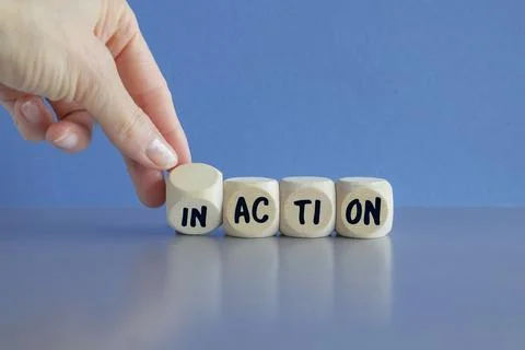 Hand turns a dice and changes the word Inactive to Active. Stock Photos