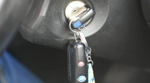 Hand turns the key in the ignition Stock Footage 62079610