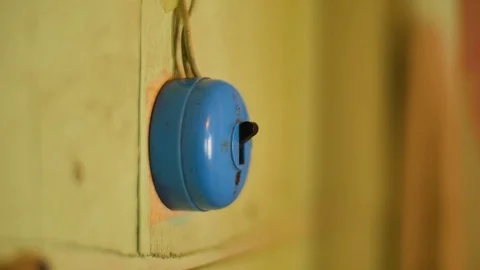 Hand turns off an on a light switch Stock Footage 70764055