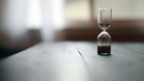Hand turns over sand time capsule, video Stock Footage 71656280