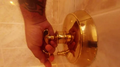 Hand turns shower on Video stock 41687947