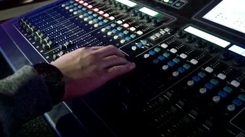Hand turns the sound Stock Footage 55517736